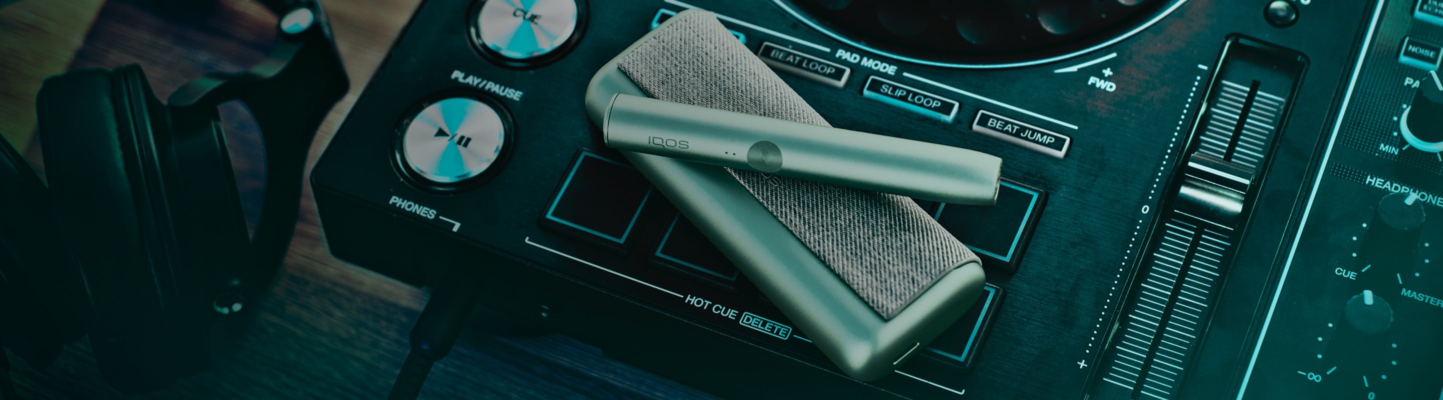 An IQOS device on a sound mixing board.