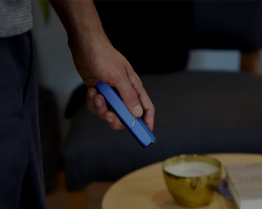 Blue IQOS 3 Multi in a man's hand