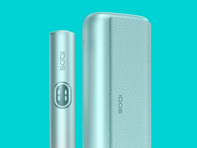 Breeze Blue IQOS ILUMA i PRIME device standing near its charger