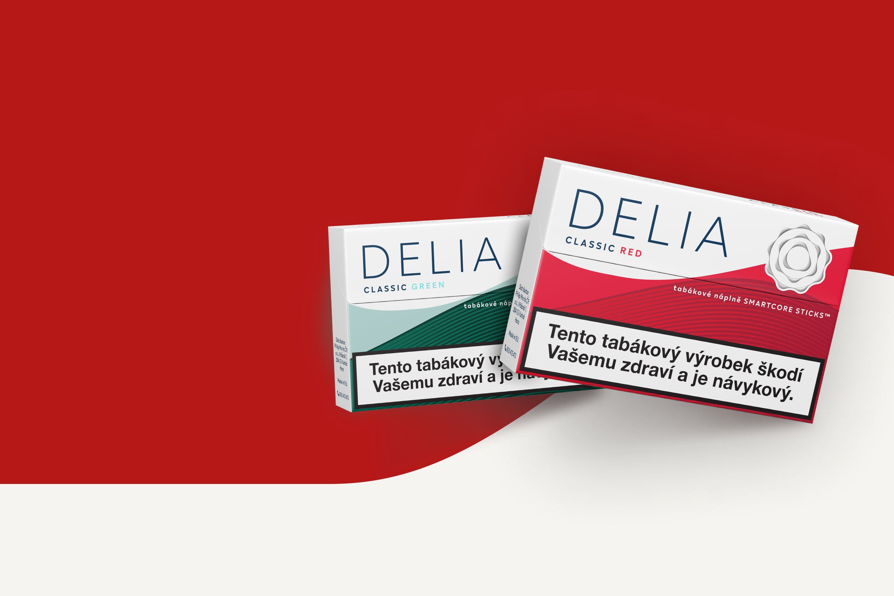 Čelní pohled na dvě krabičky DELIA: příchutě Classic Green a Classic Red