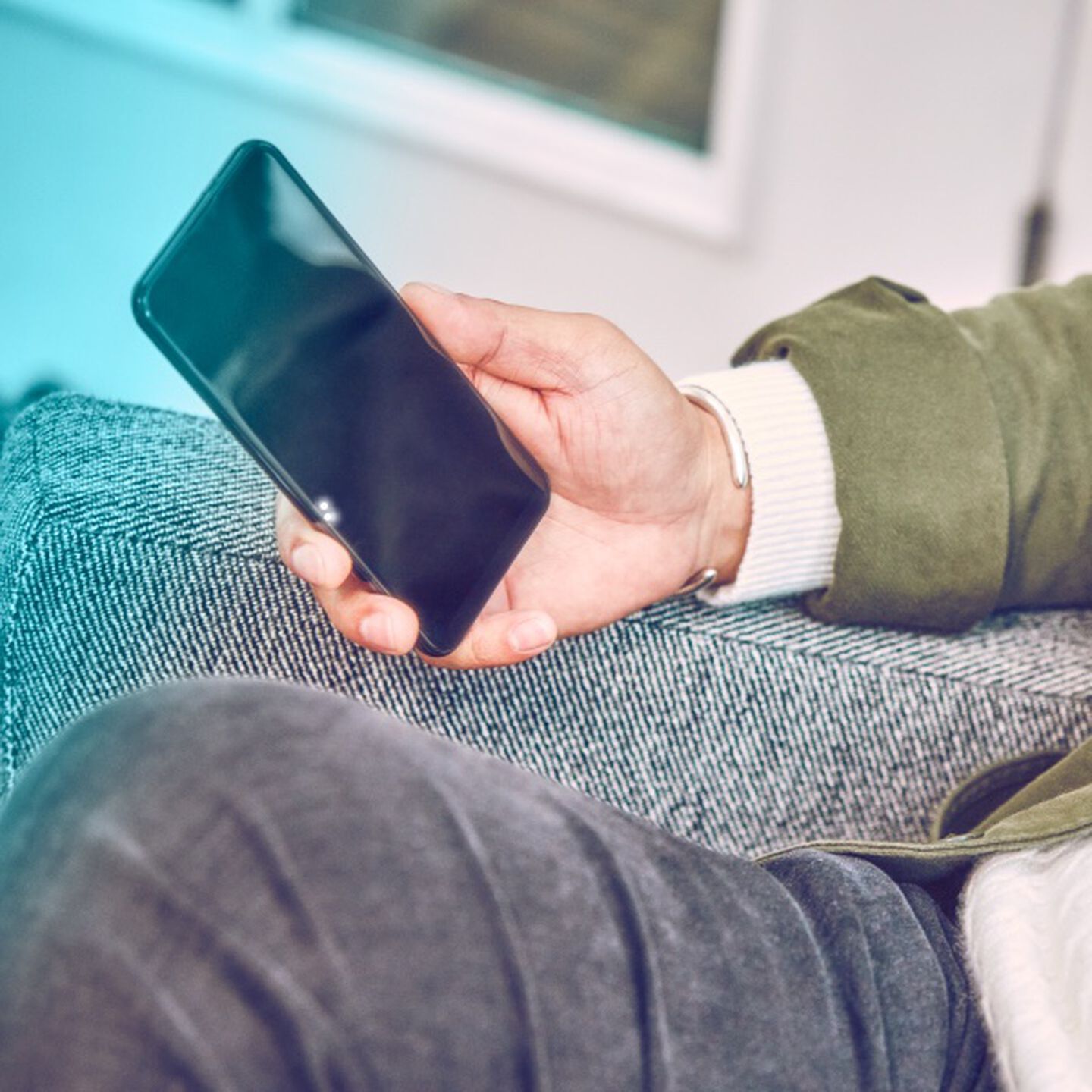 A person holding a mobile phone