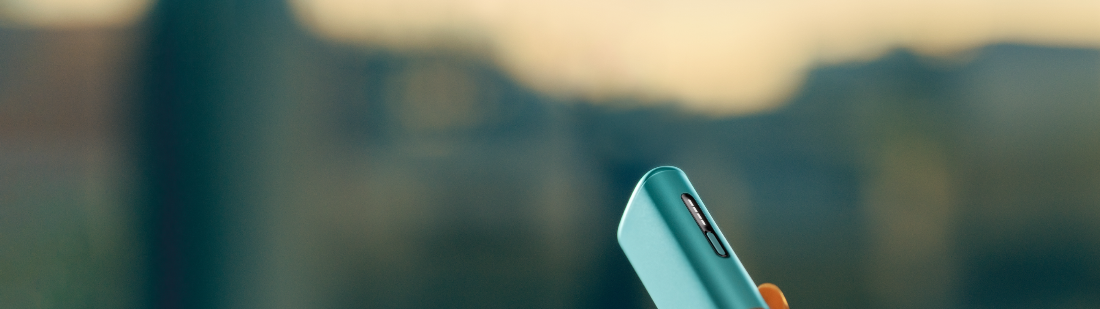 : A Breeze Blue IQOS ILUMA i ONE device.
