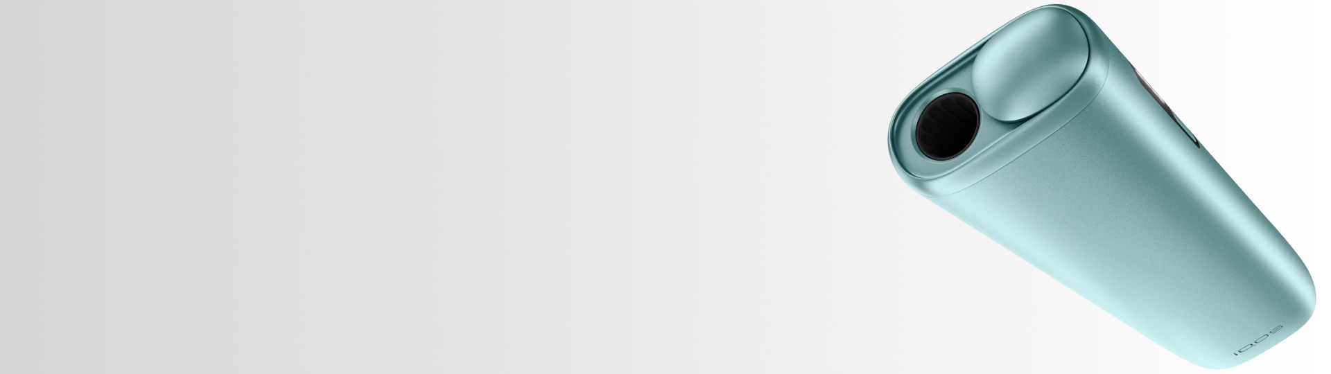 IQOS Iluma i turquesa con cargador pastel abierto sobre superficie blanca