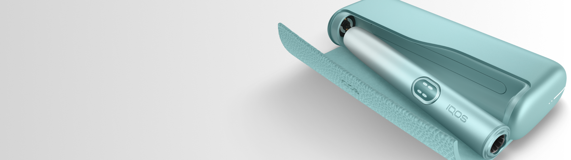 Dispositivo IQOS ILUMA PRIME color verde menta sobre fondo blanco, acompañado del texto “Tus primeros pasos con IQOS ILUMA i”.