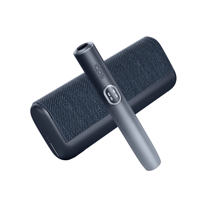 IQOS ILUMA PRIME color negro con holder colocada sobre la tapa, acompañado de texto “Unidades de tabaco para calentar”.