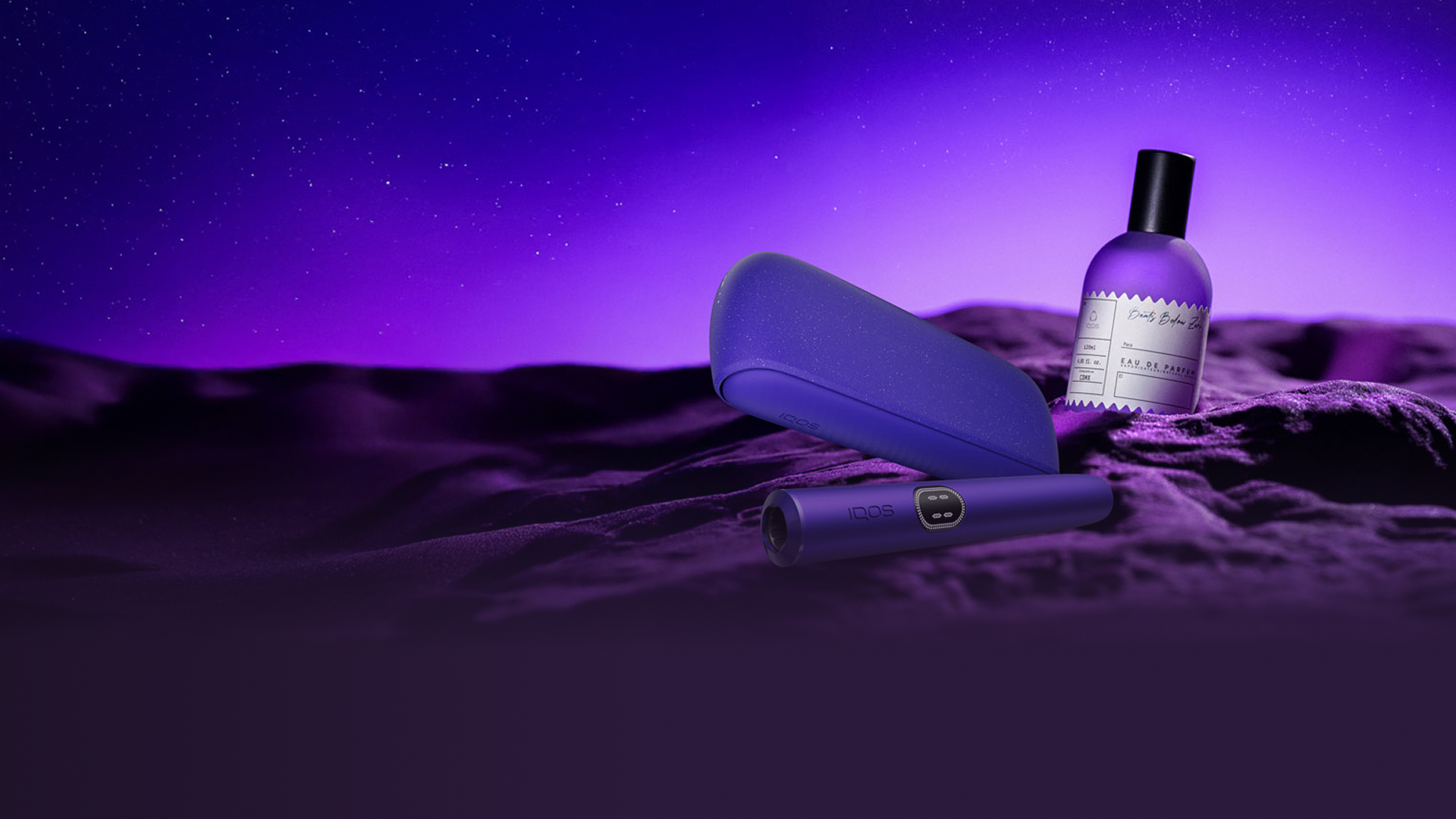 Dispositivo IQOS ILUMA i color breeze blue con holder,y IQOS ILUMA i ONE color midnight, sobre fondo con diseño circular y texto “Nuevo IQOS ILUMA i. Modo Pausa, Botón Táctil y mucho más”.