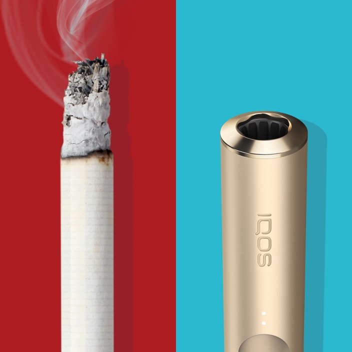Lit cigarette end compared to IQOS 3 DUO holder.