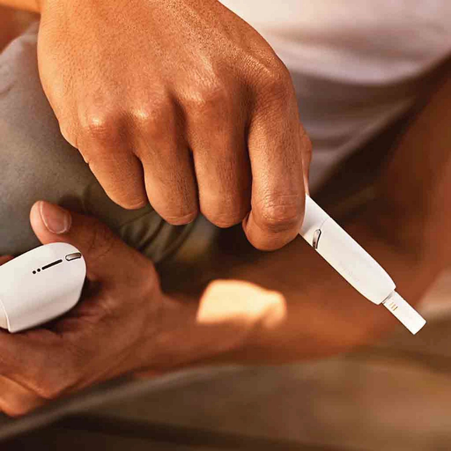 White IQOS heated tobacco device