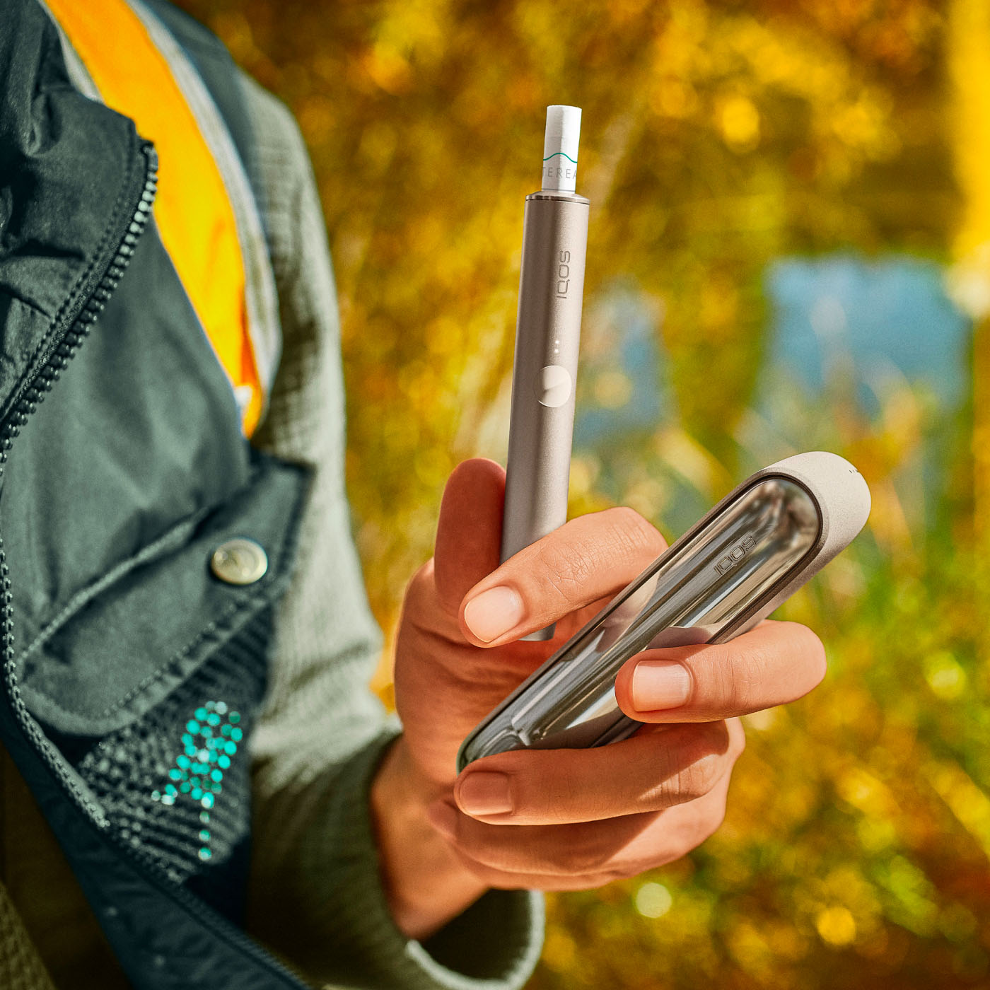Hand holding heated tobacco product