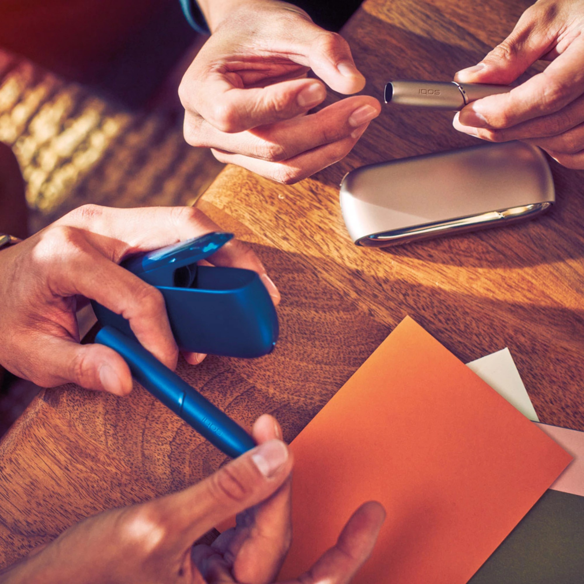 A Stellar Blue and Brilliant Gold IQOS device together