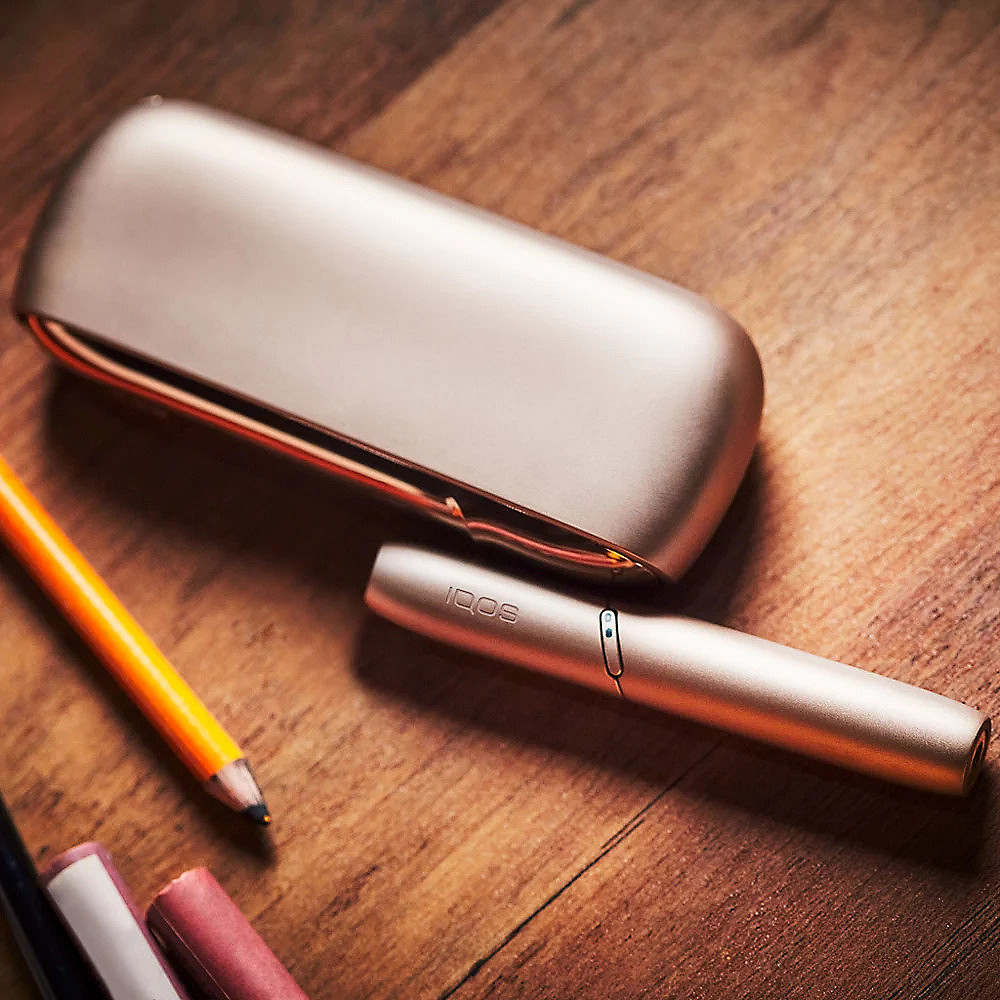Heated tobacco device on table