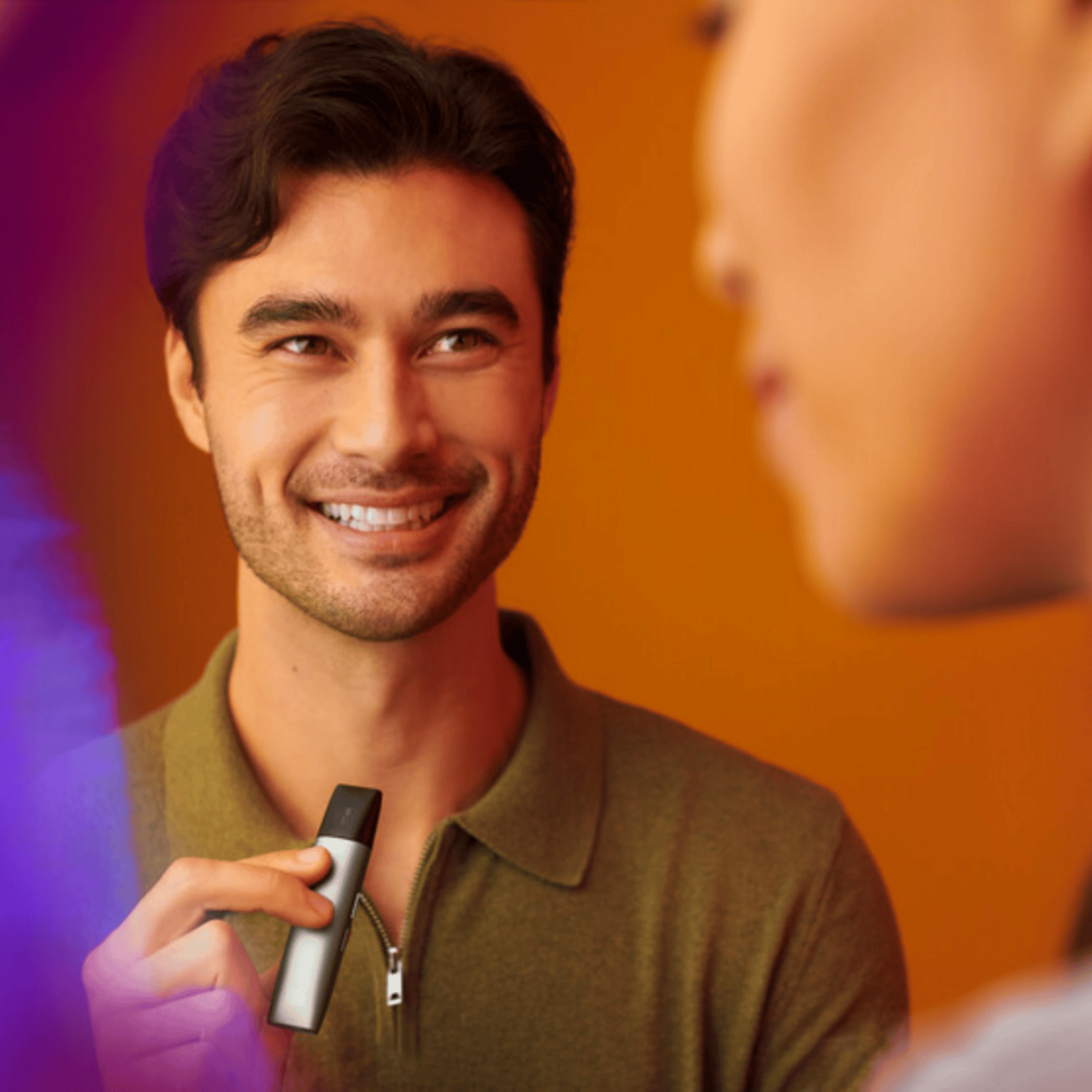 Adult holding a vape pen