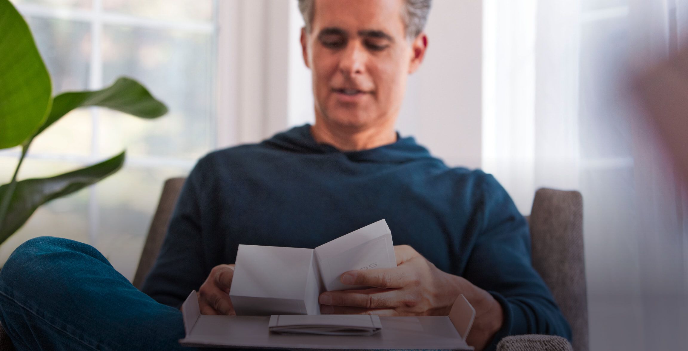 A man with an IQOS box.