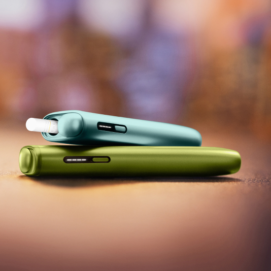 two IQOS Iluma I One devices on a bacground of a table