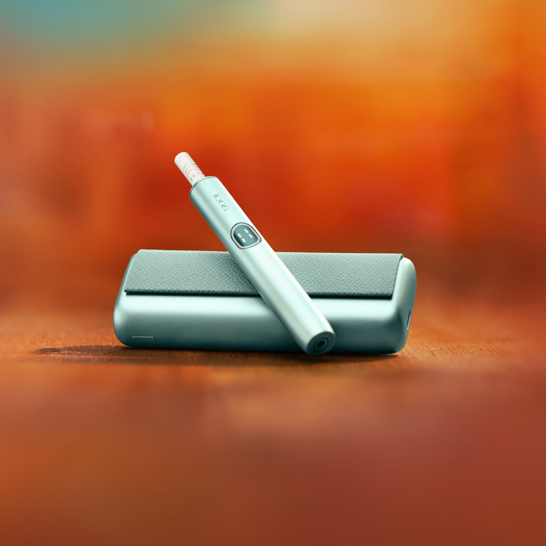 Breeze Blue IQOS ILUMA i Prime Charger and Holder on table background