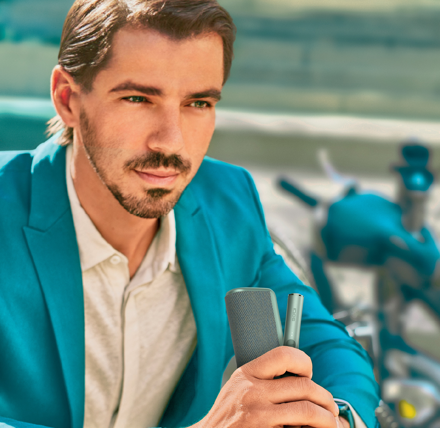A man using an IQOS device. 