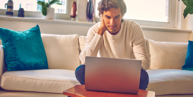 A person using a laptop. A person using a laptop.