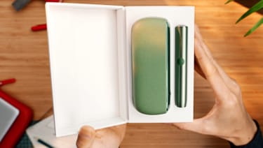 An IQOS ILUMA  Holder and Pocket Charger in a box.