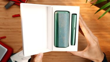 An IQOS ILUMA PRIME Holder and Pocket Charger in a box. 