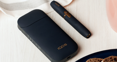 Black and white IQOS 2.4 Kit on a table
