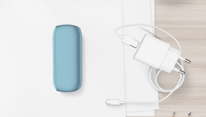 Turquoise IQOS ORIGINALS DUO pocket charger next to cable charger. Turquoise IQOS ORIGINALS DUO pocket charger next to cable charger.
