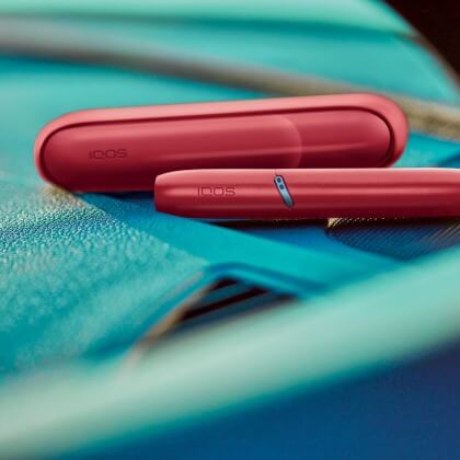 IQOS Originals Duo holder and pocket charger in red color. IQOS Originals Duo holder and pocket charger in red color.