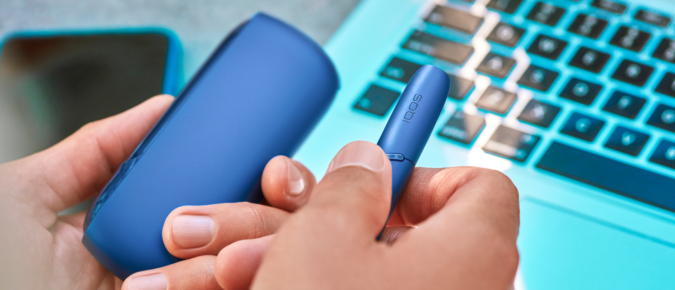 hand showing an IQOS 3 DUO holder
